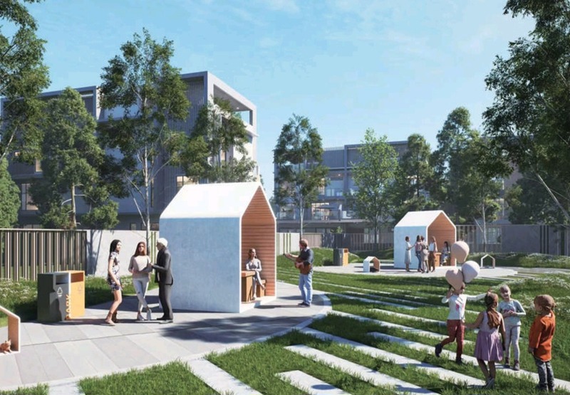 D-101 Kobusak entrance with signage, landscaped roundabout, and residents enjoying the community